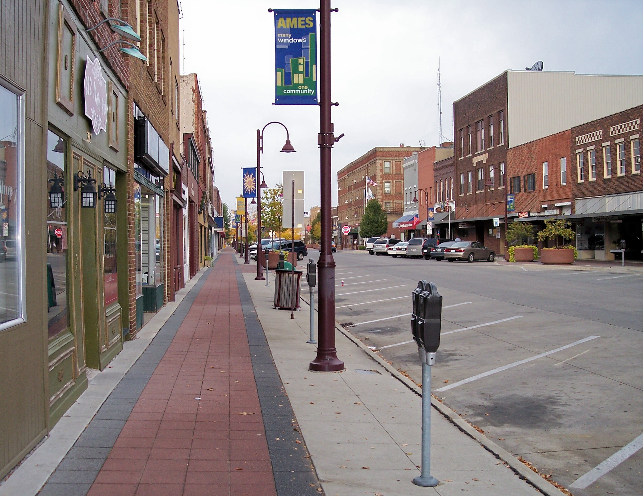 Brick storefronts along Main Street in Ames, Iowa; representative photography for this fictional town